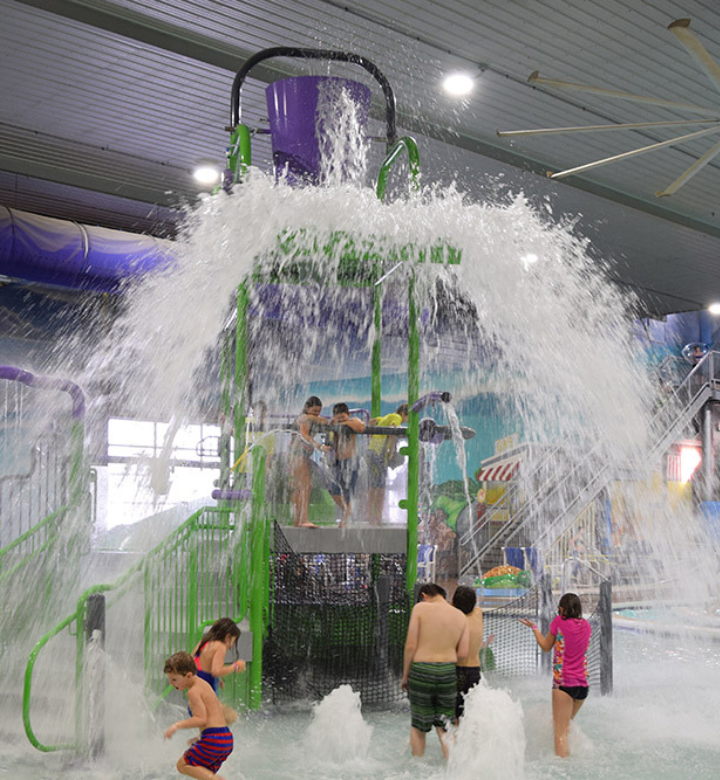 The dump bucket splashing on kids in the aquatic playground at Chaos Water Park in Eau Claire, WI.
