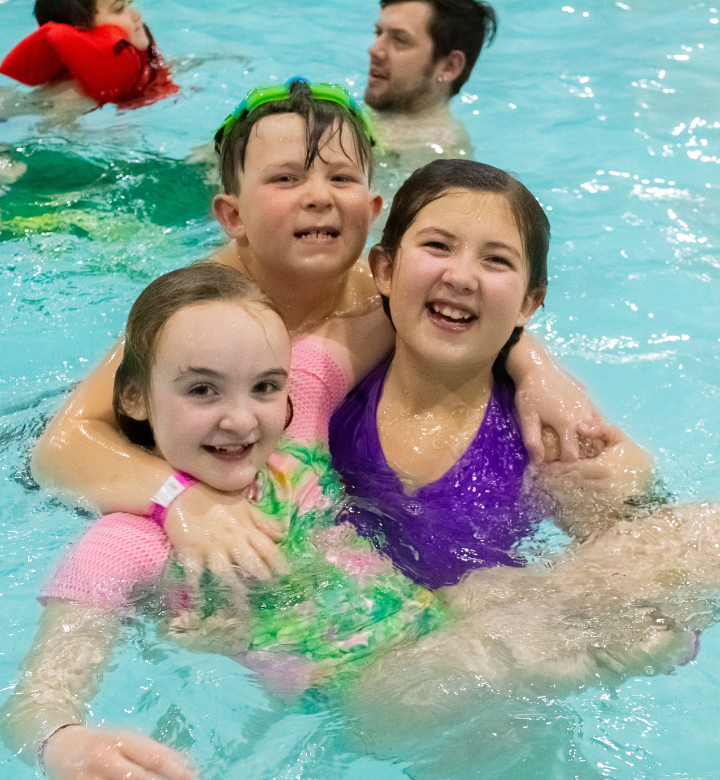 Kids swimming in the activity pool at Chaos Water Park in Eau Claire, WI.