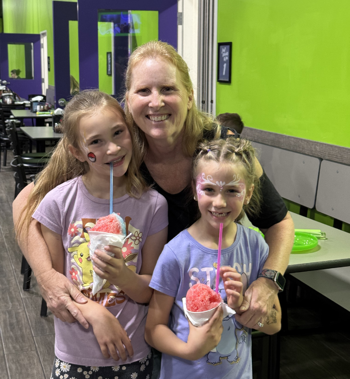 Mom and daughters at Action City Customer Appreciation Party