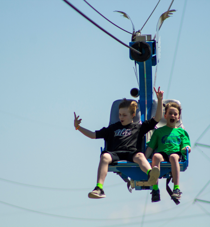 Kids on the outdoor zipline at Action City in Eau Claire, WI.