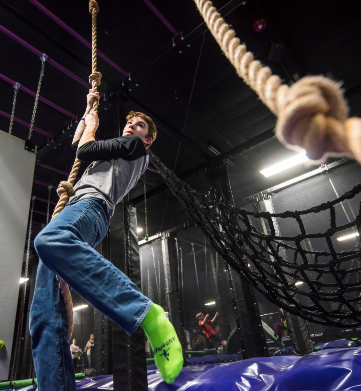 A teenage boy in the trampoline park at Action City A teenage boy in the trampoline park at Action City