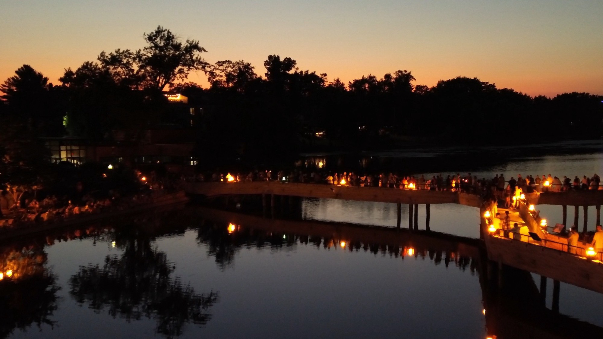 Brighton Mill Pond and pedestrian bridge at twilight during Taste of Brighton, July 2026