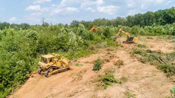 Heavy equipment performing land and site work