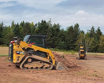 Heavy equipment grading land