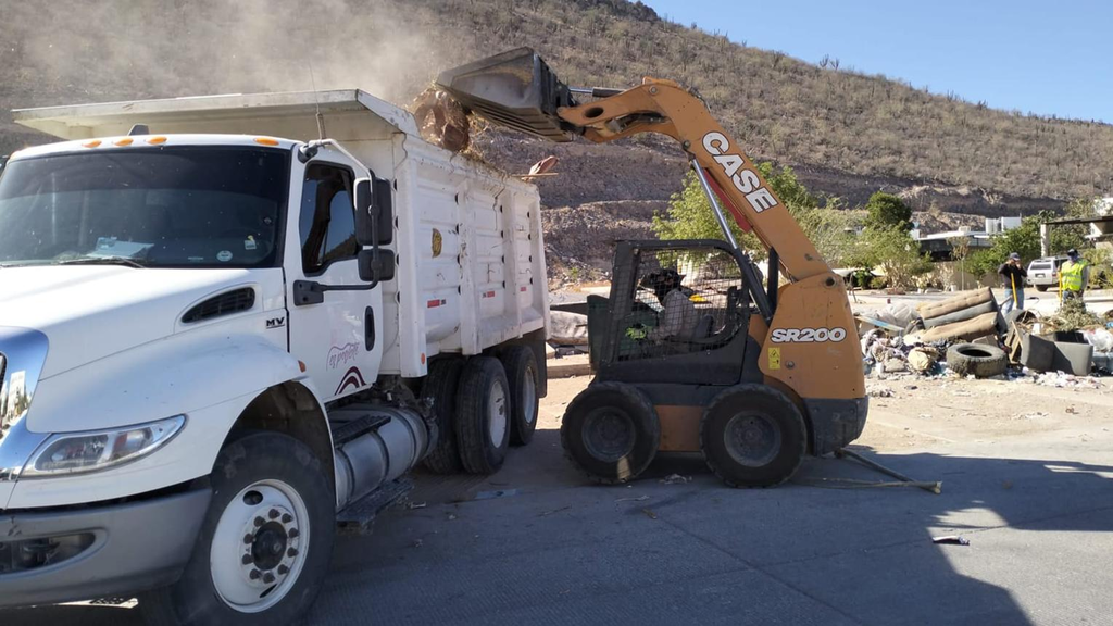 Truck hauling debris from a site