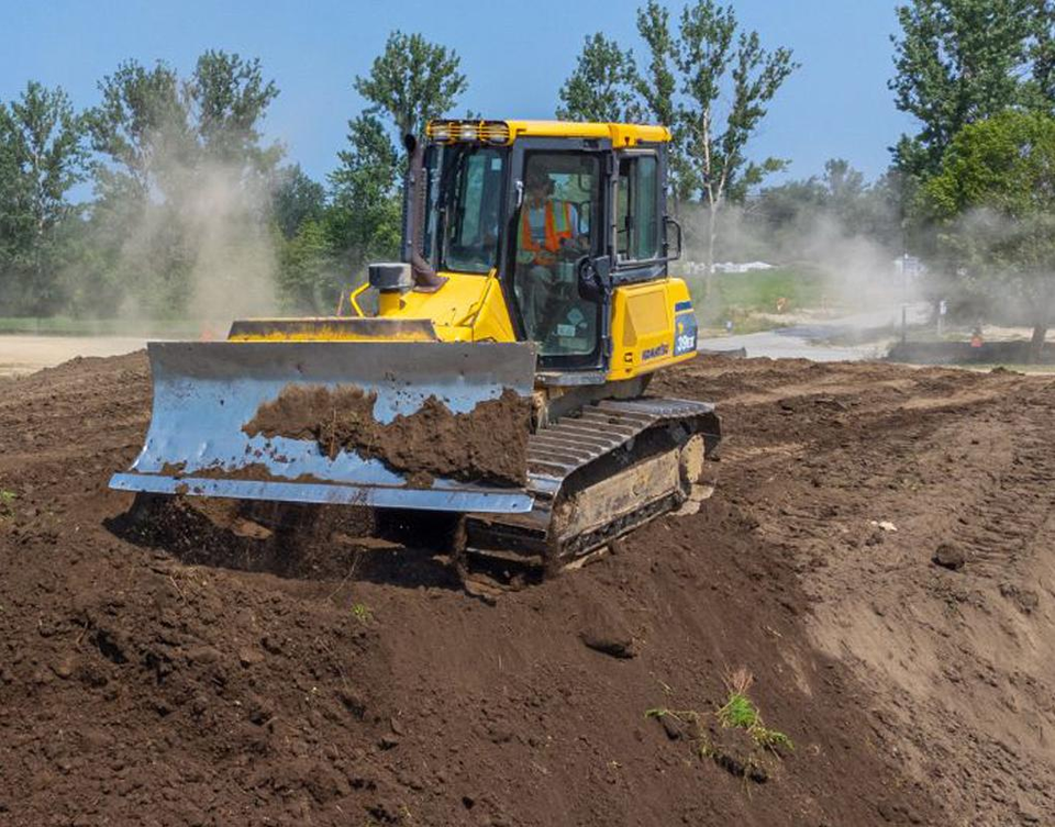 Heavy equipment grading land