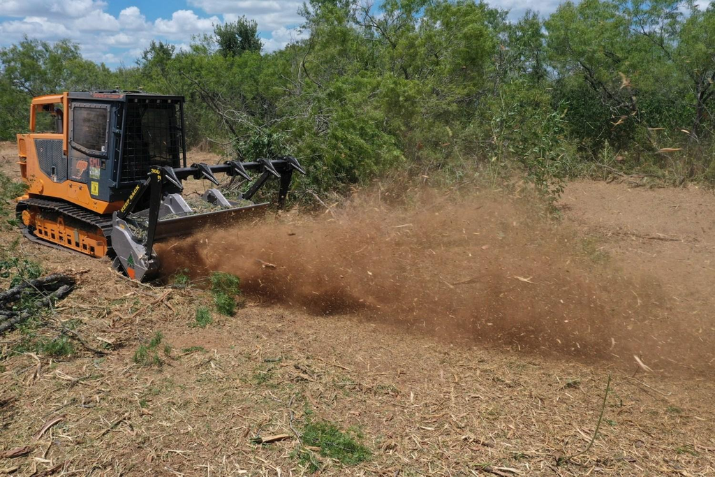 Land clearing equipment working on property