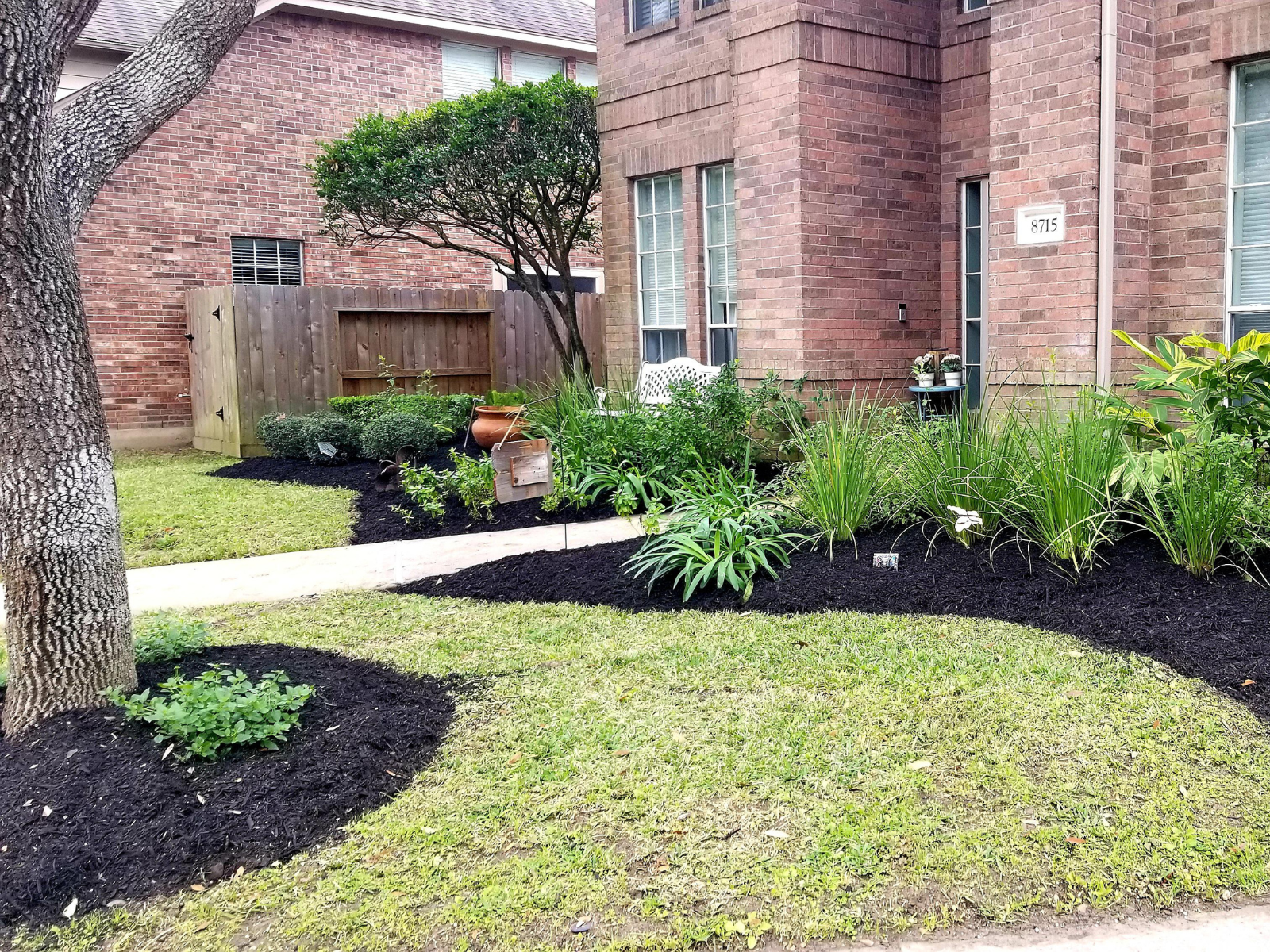 Fresh mulch beds with neat edging and maintained landscaping