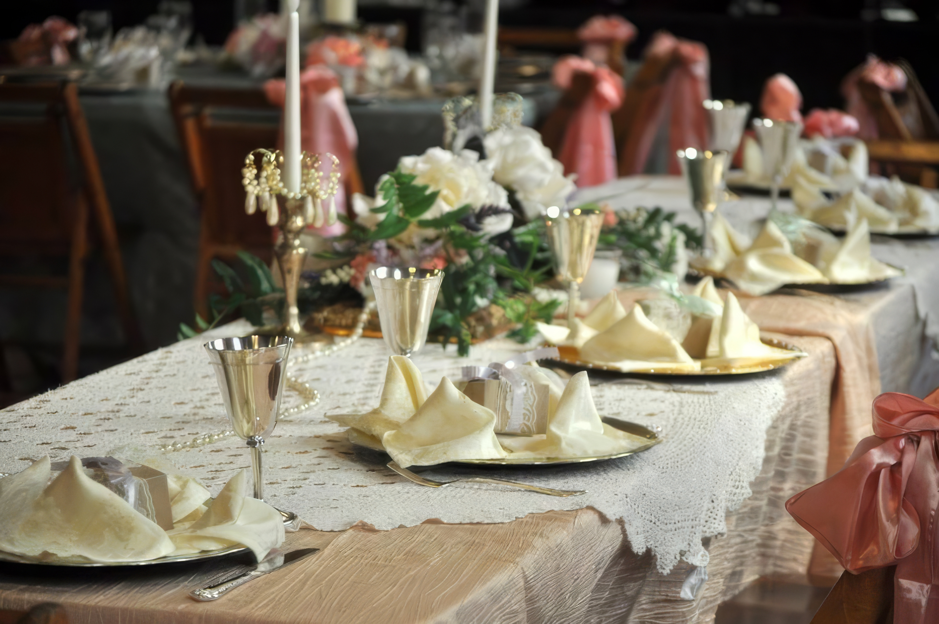 Elegant tablescape with gold chargers and floral centerpiece