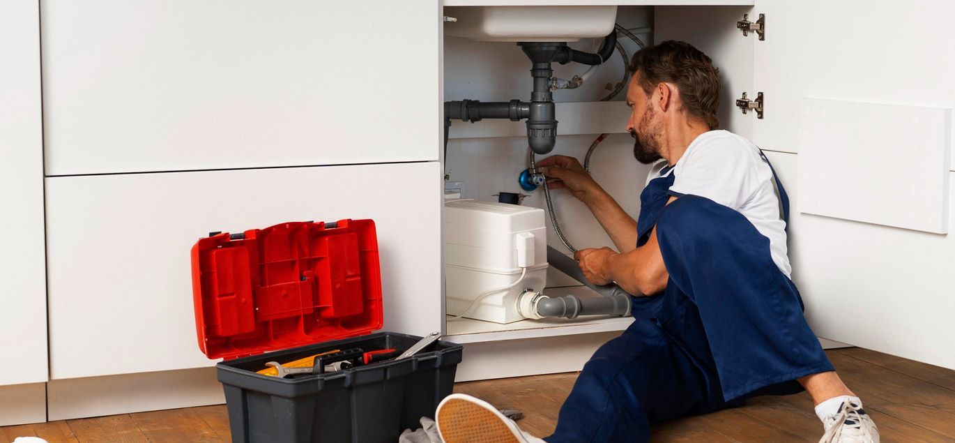 Technician performing annual water softener maintenance in Central Florida