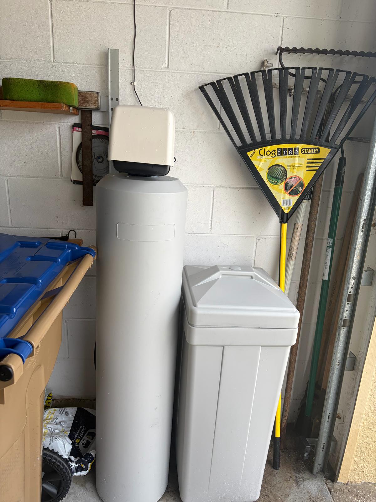 Professional water softener installation in a clean Florida garage