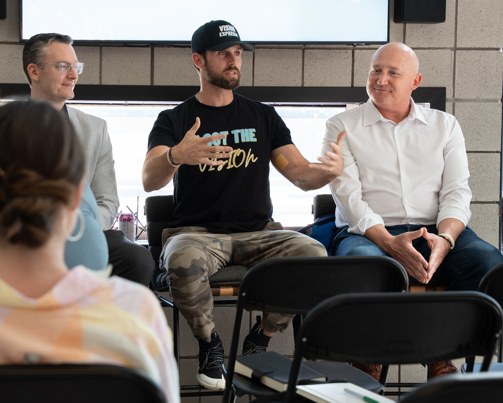 Sebastian on stage with panel