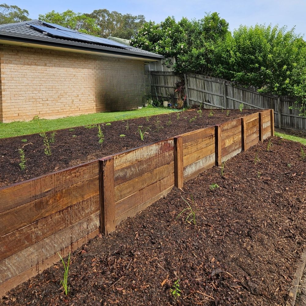 Professionally built timber retaining wall in Sunshine Coast backyard