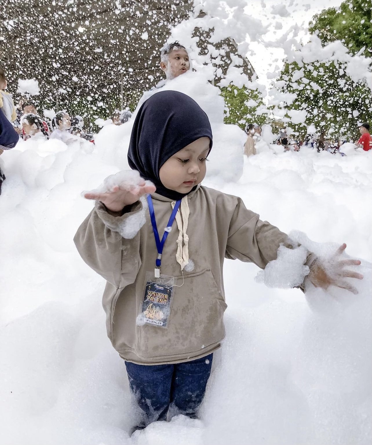 Foam party kids playing in foam