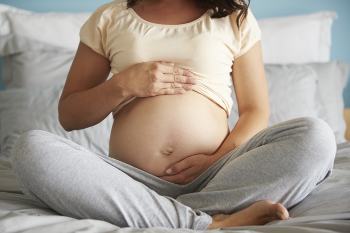 Pregnant woman receiving gentle prenatal chiropractic care in North Chesterfield VA