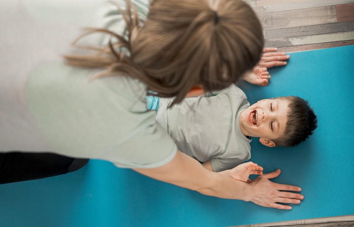 Chiropractor performing gentle pediatric adjustment on infant in North Chesterfield VA