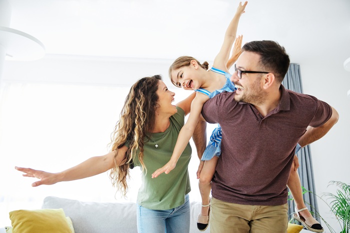 Energized parent enjoying time with kids after chiropractic care in North Chesterfield VA