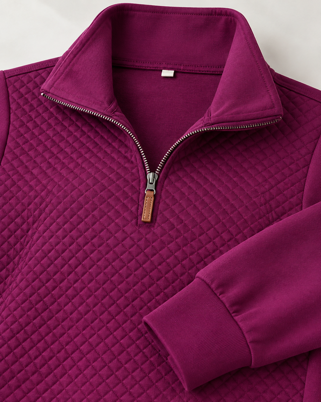 Close up of the Quarter Zip Quilted Pullover Sweatshirt, highlighting the collar and zipper. Close up of the Quarter Zip Quilted Pullover Sweatshirt, highlighting the collar and zipper.