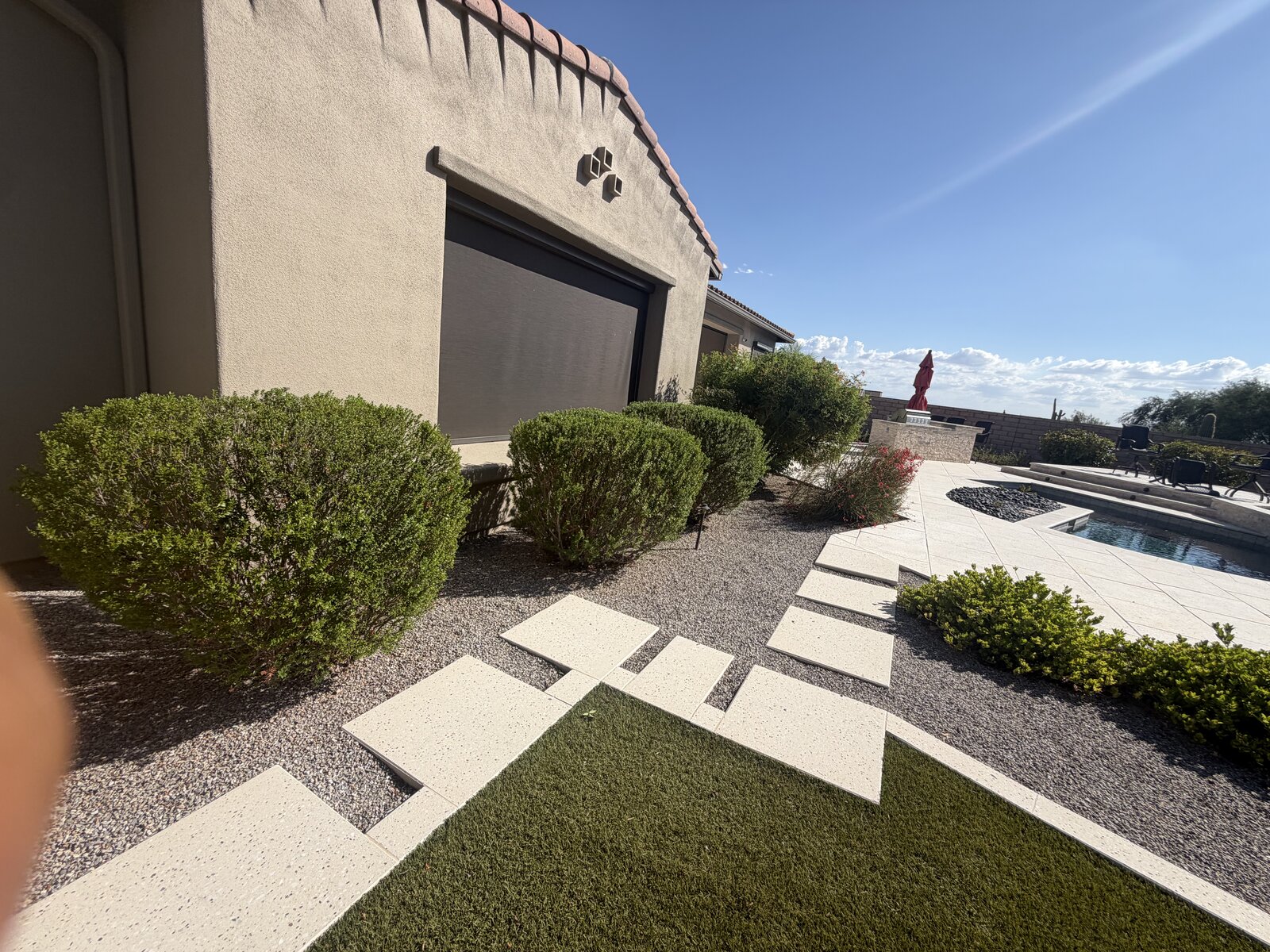 Backyard turf and large-format paver stepping stones