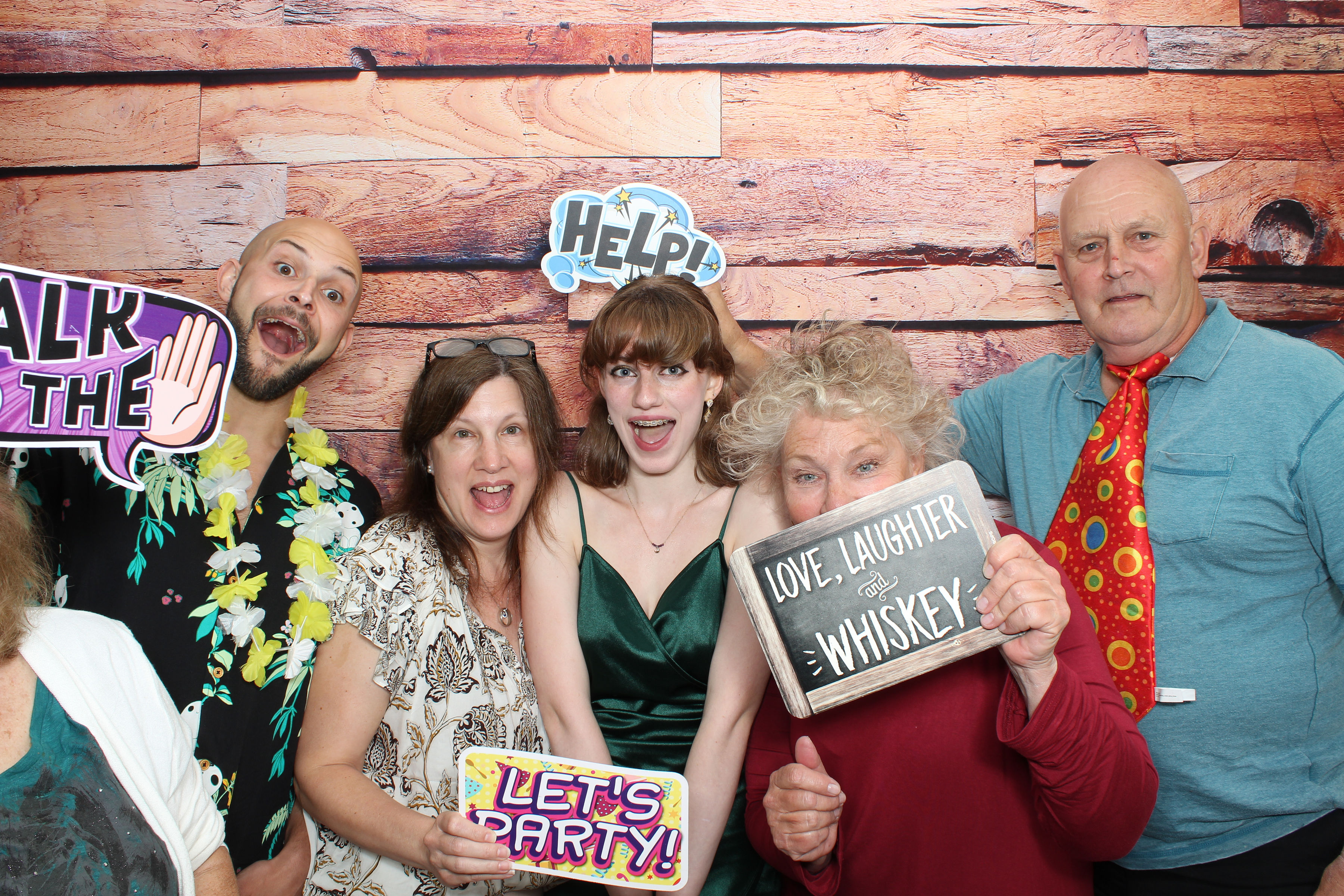 Group of friends posing together at the photo booth