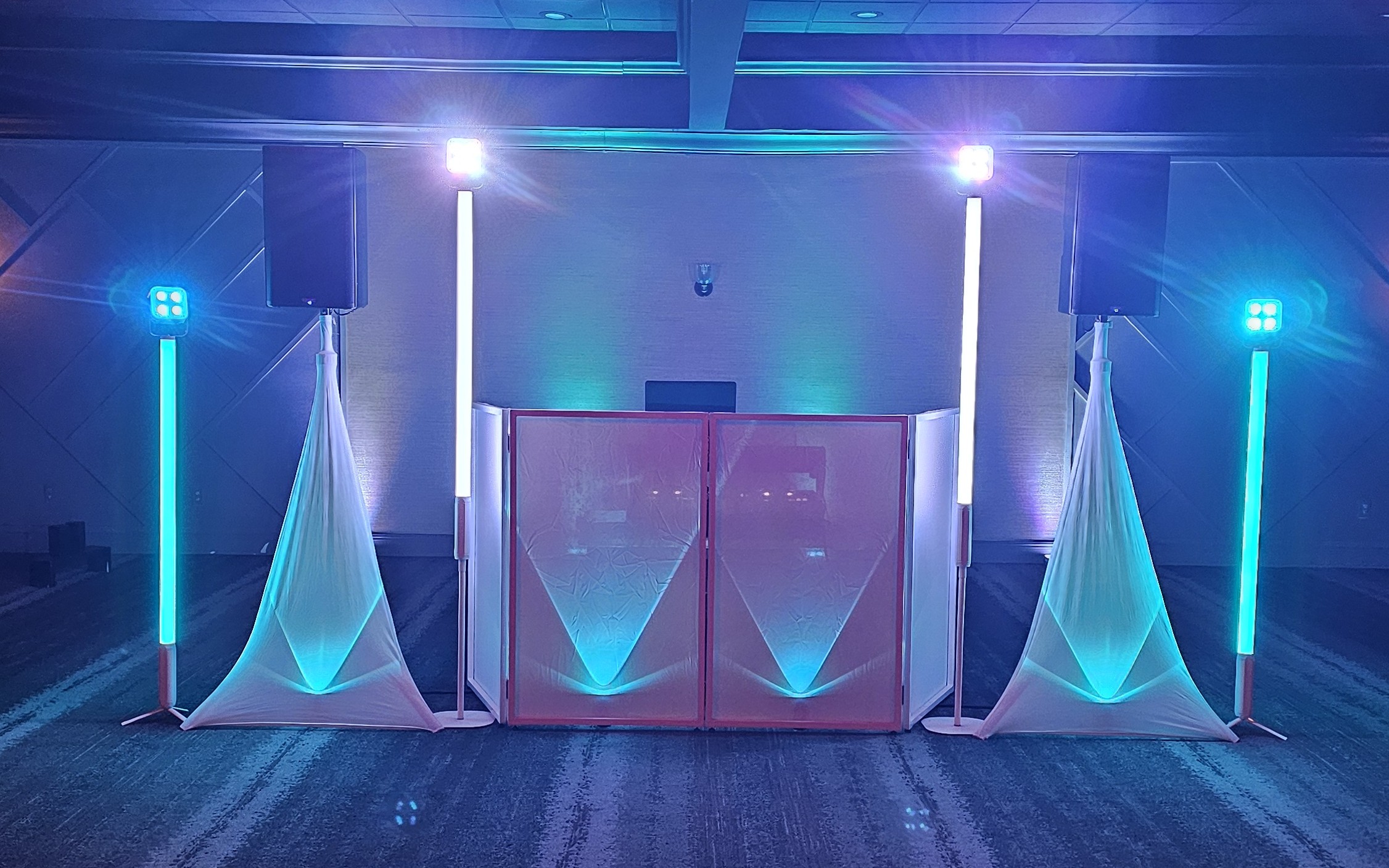 DJ booth with uplighting set up for a reception at The Landing in Matamoras, PA