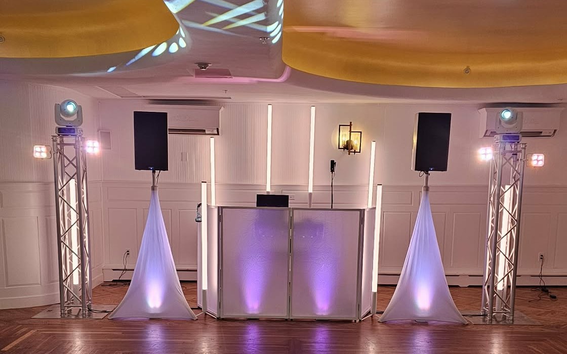 Sweet 16 DJ setup with a white facade, light tubes and moving head lights on truss at Tom Quick Inn in Milford, PA
