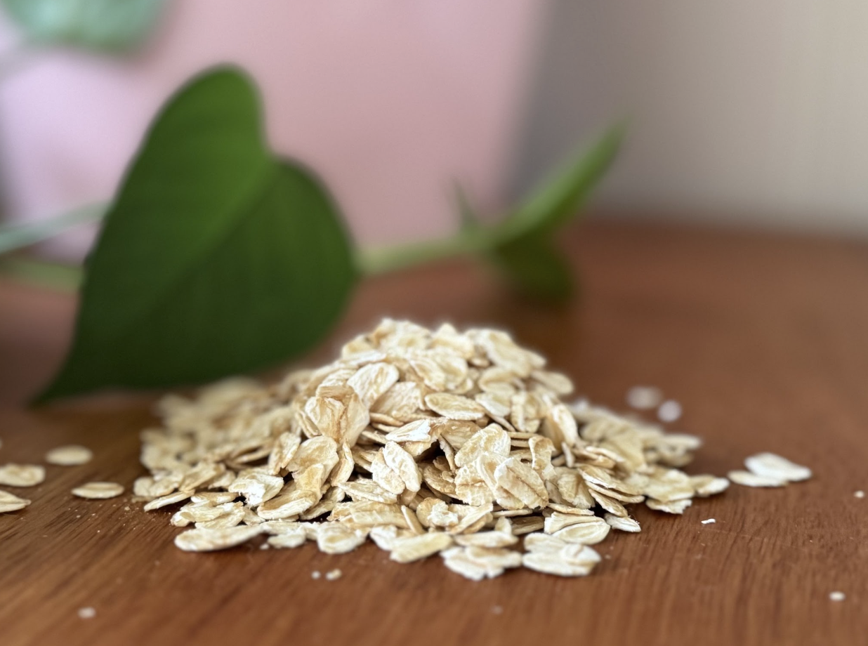 A pile of raw rolled oats on a table A pile of raw rolled oats on a table