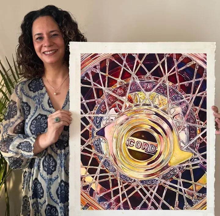 Mandeep Merwah with a finished realistic watercolor painting