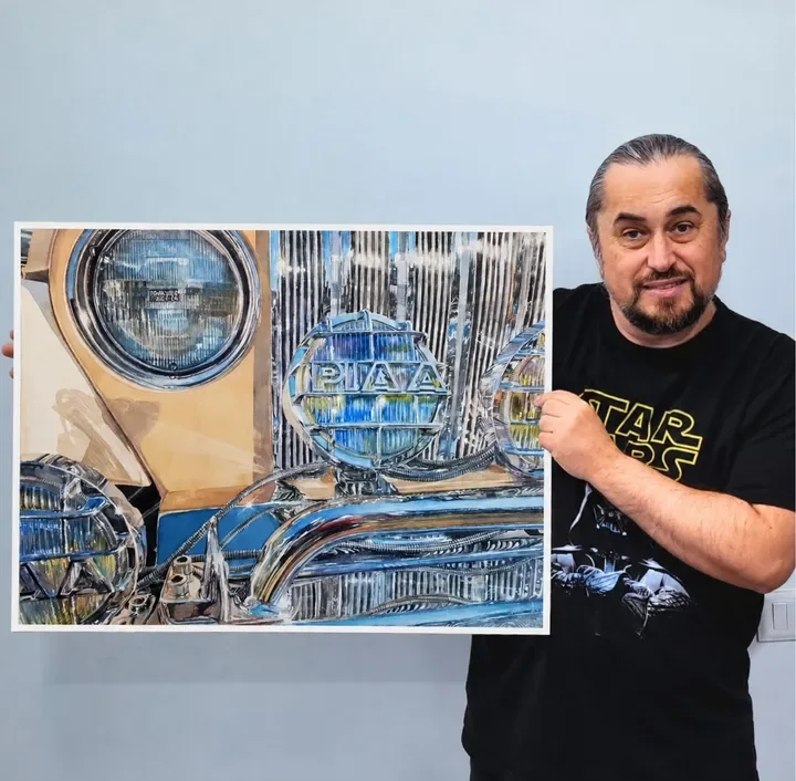 Ovidiu Iovanel with a finished realistic watercolor painting