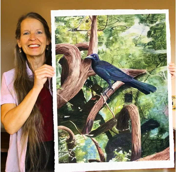 Peggy Covic with a finished realistic watercolor painting