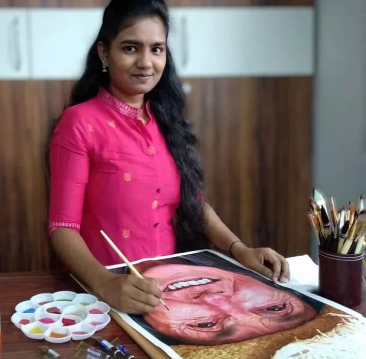 Tejaswini M S with a finished realistic watercolor painting