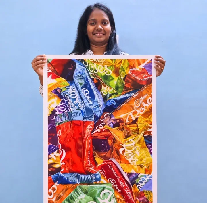 Anusha Mohan with a finished realistic watercolor painting