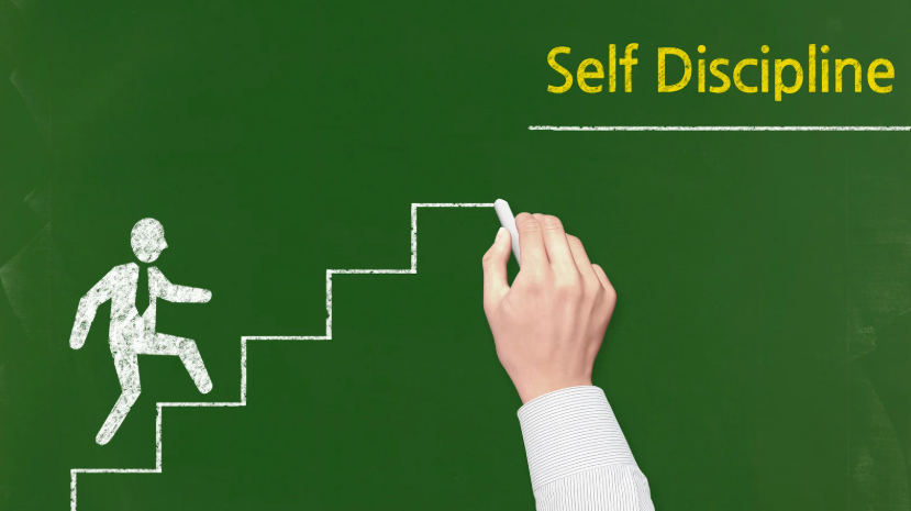 Hand drawing staircase on green board with figure climbing steps, symbolizing self-discipline, growth, and progress toward goals