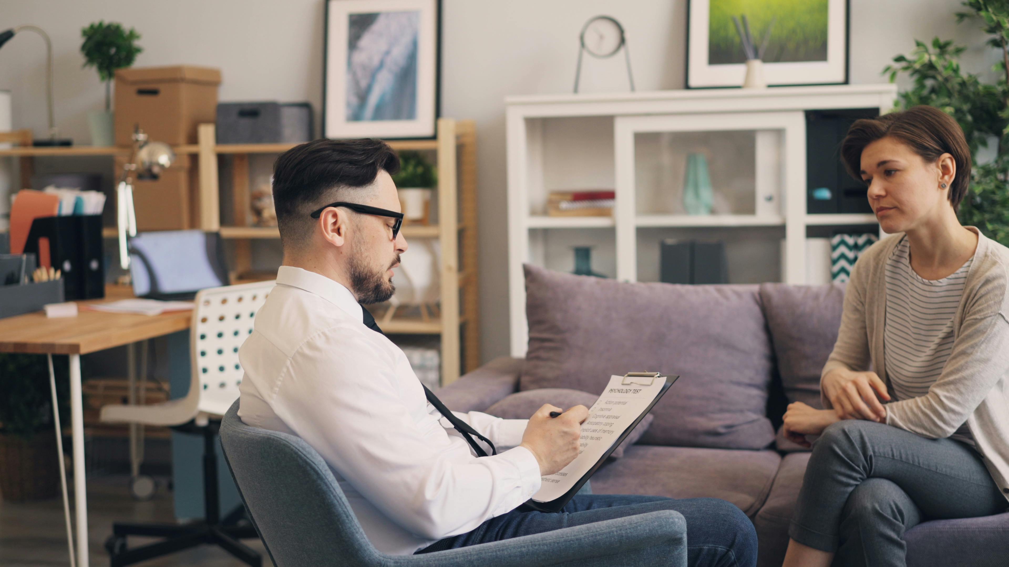 Adult ADHD coaching session with professional helping client improve focus and productivity Adult ADHD coaching session with professional helping client improve focus and productivity