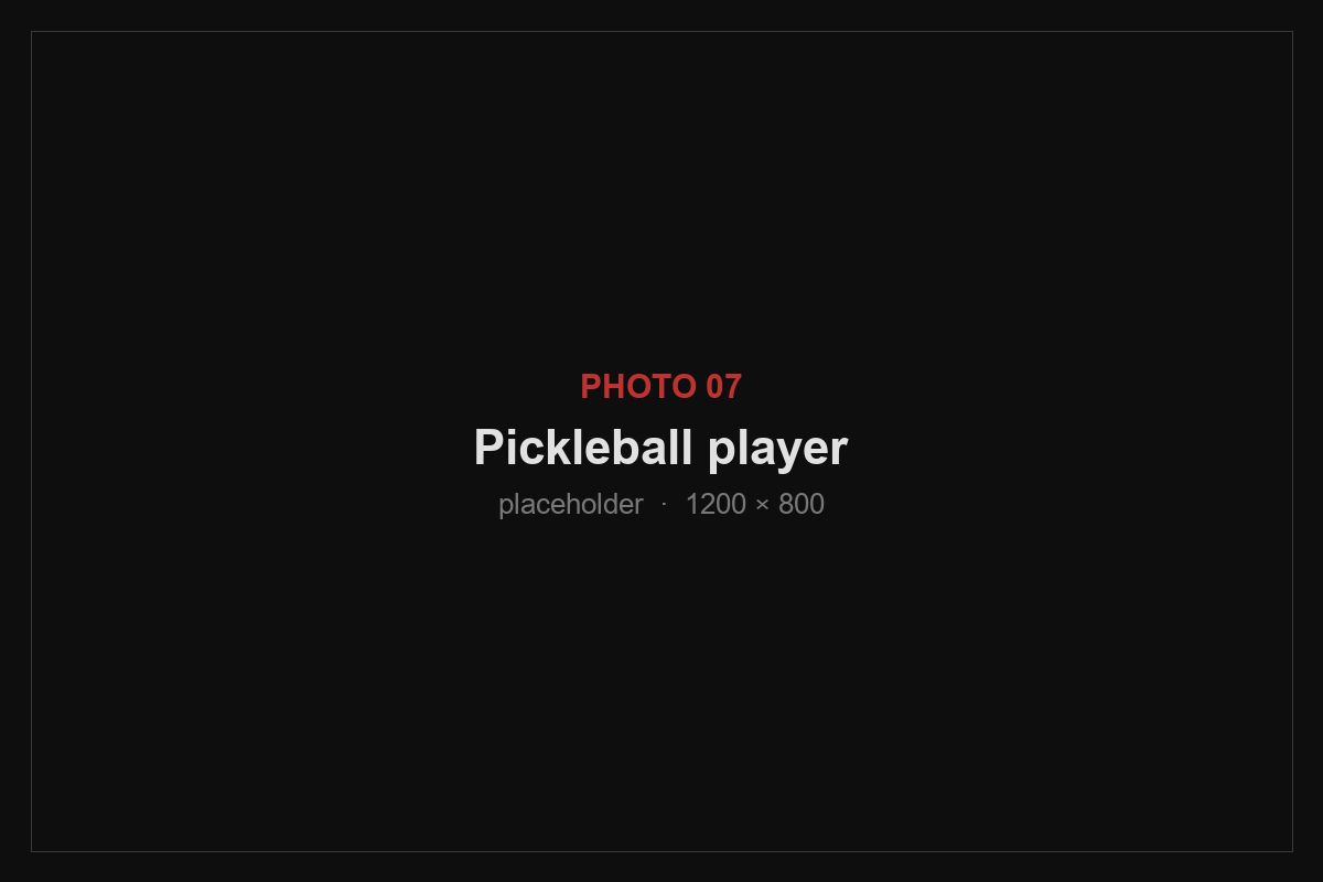 A pickleball player mid-rotation