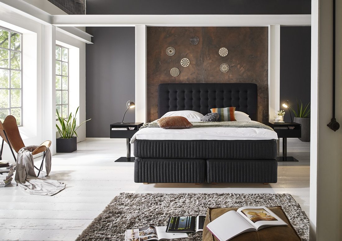 A Kamjo continental bed dressed in a bright bedroom