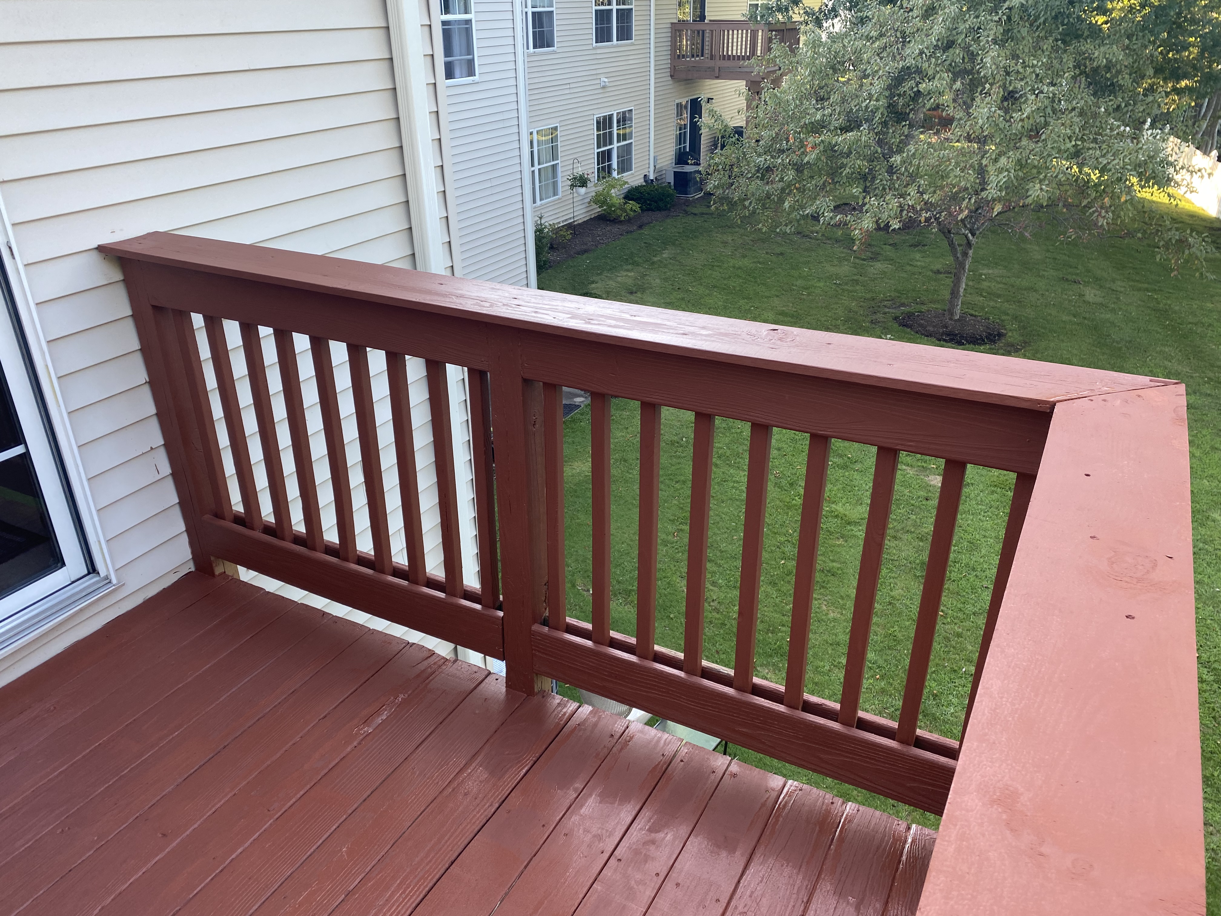 Exterior staircase and railing built by Platinum Werx leading to a front door