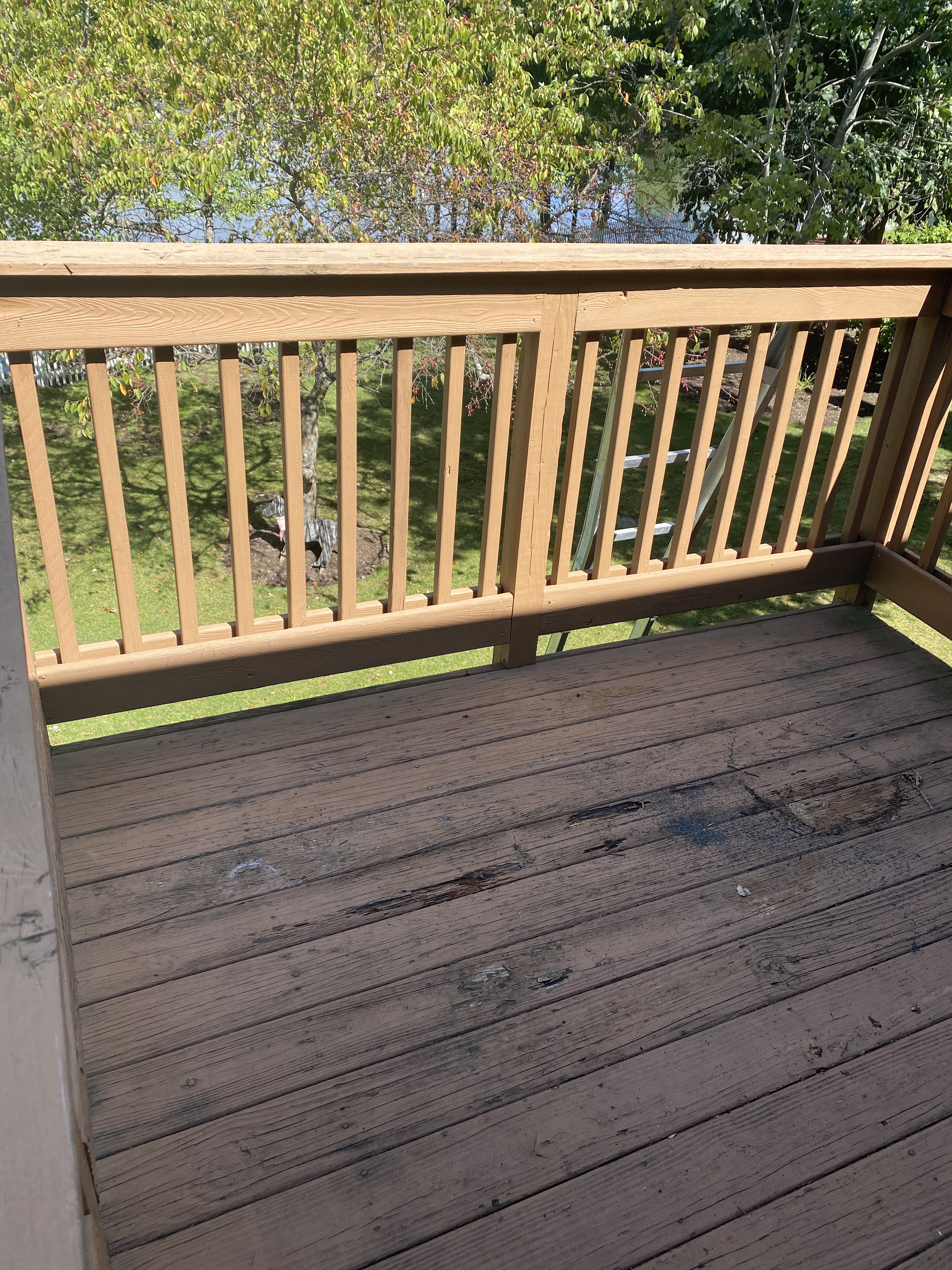 Finished exterior stairs and railing installed by Platinum Werx at a home entrance