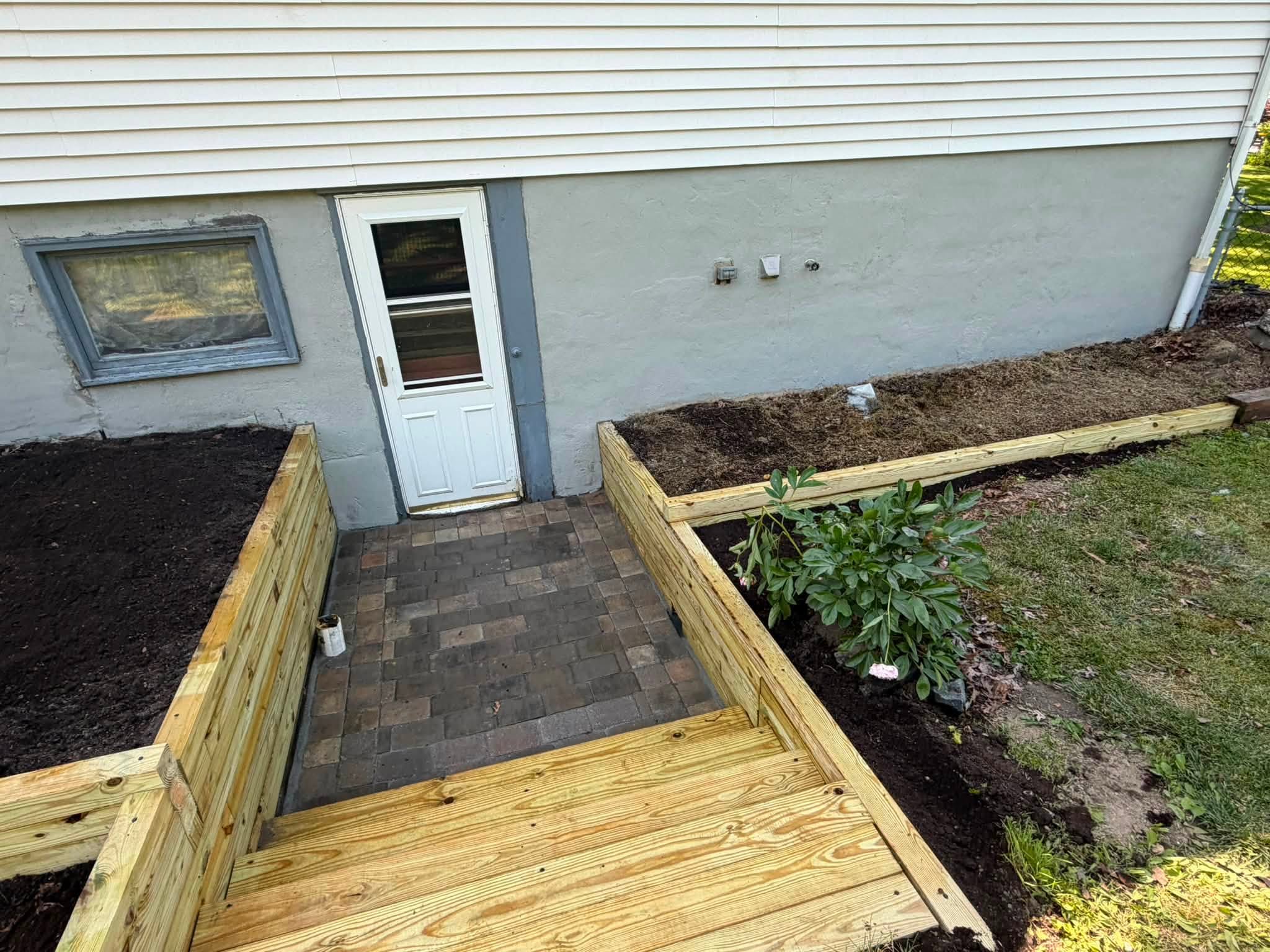 Wooden walkway leading to a back door