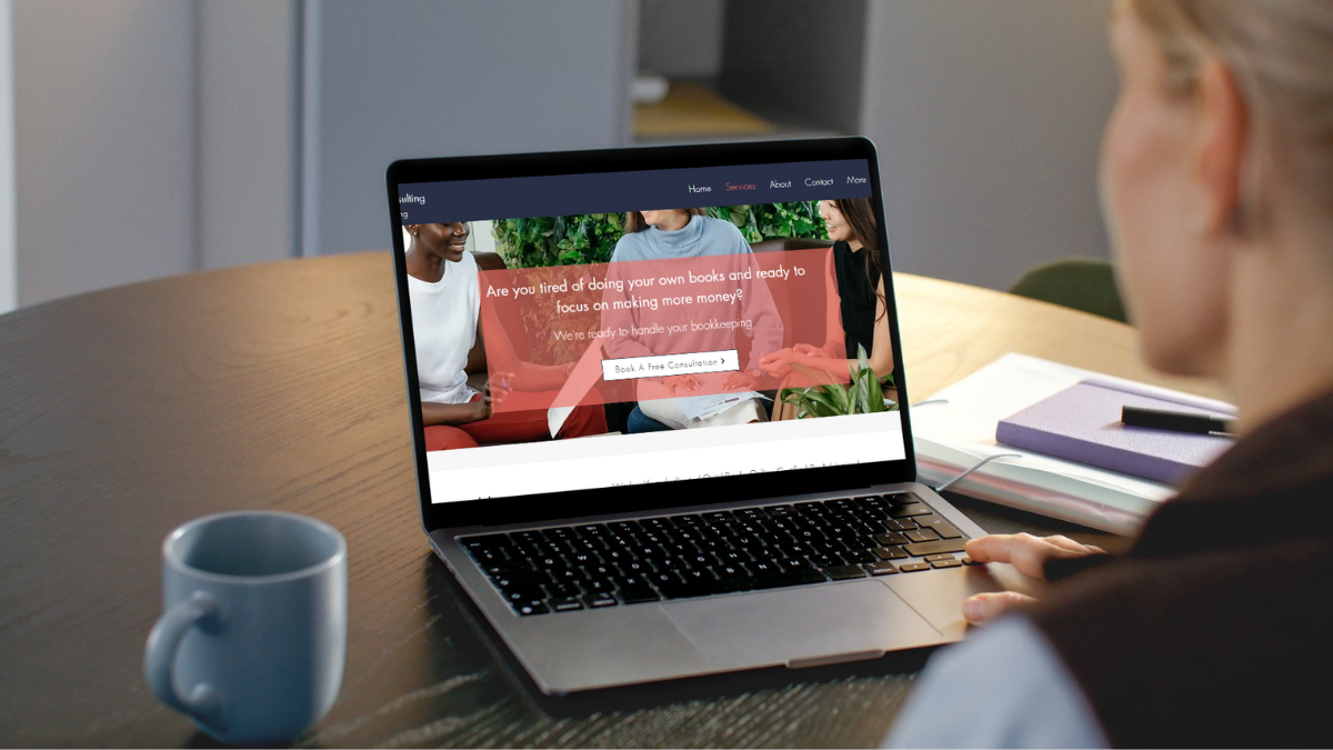 Small business owner reviewing Aurrera Bookkeeping services on a laptop