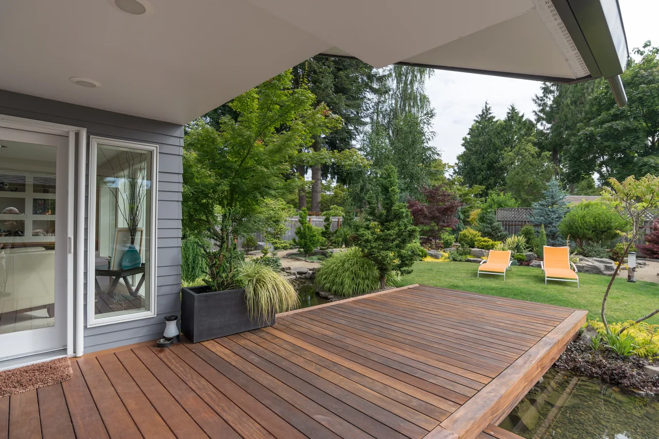 Wood deck and outdoor living space attached to a home