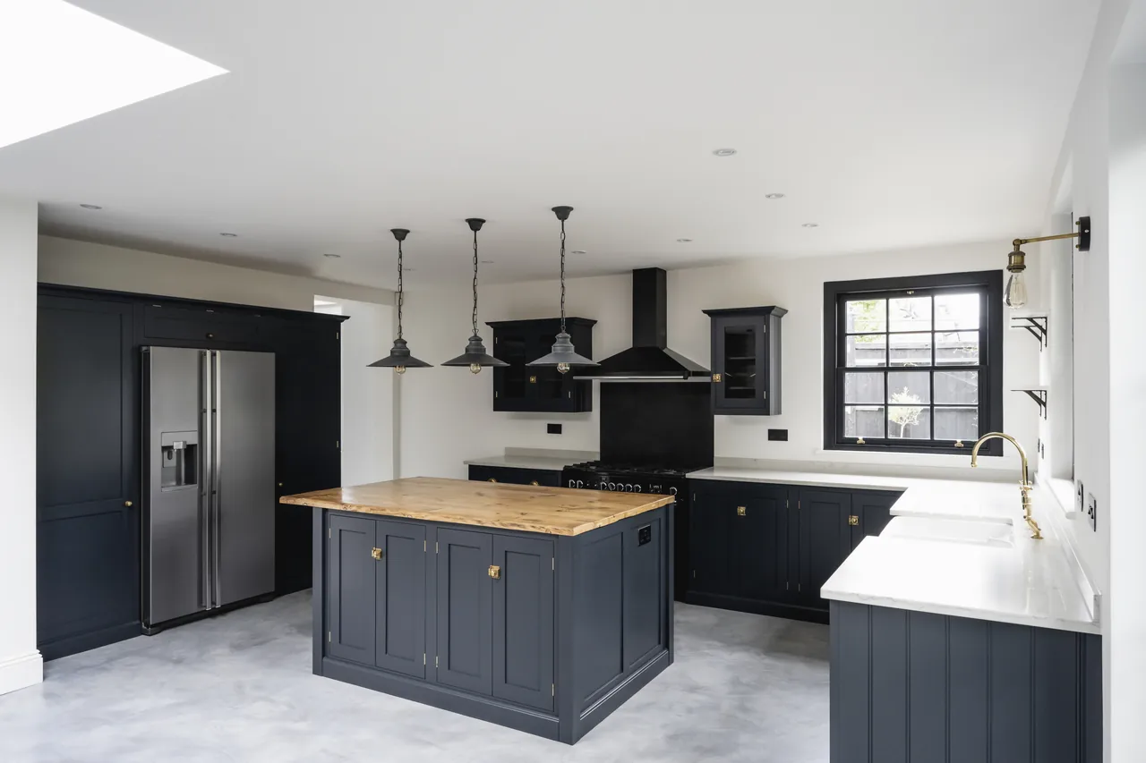 Kitchen remodel with dark cabinets and a butcher block island