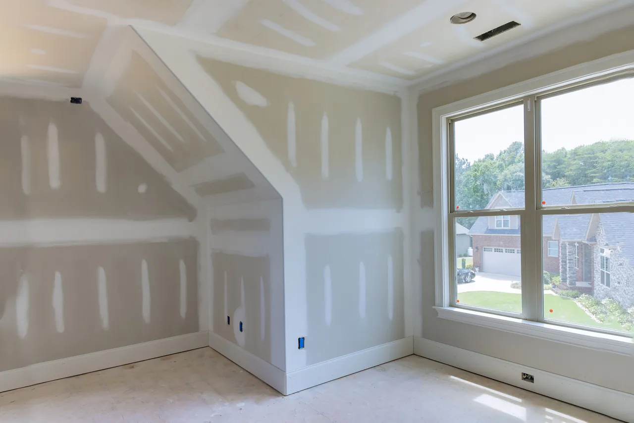 Finished drywall ready for paint in a remodeled room