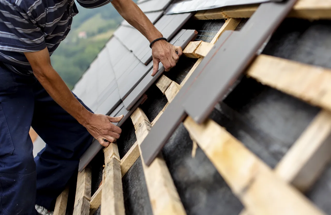 Roofing contractor in Monroe, NC completing residential roofing services