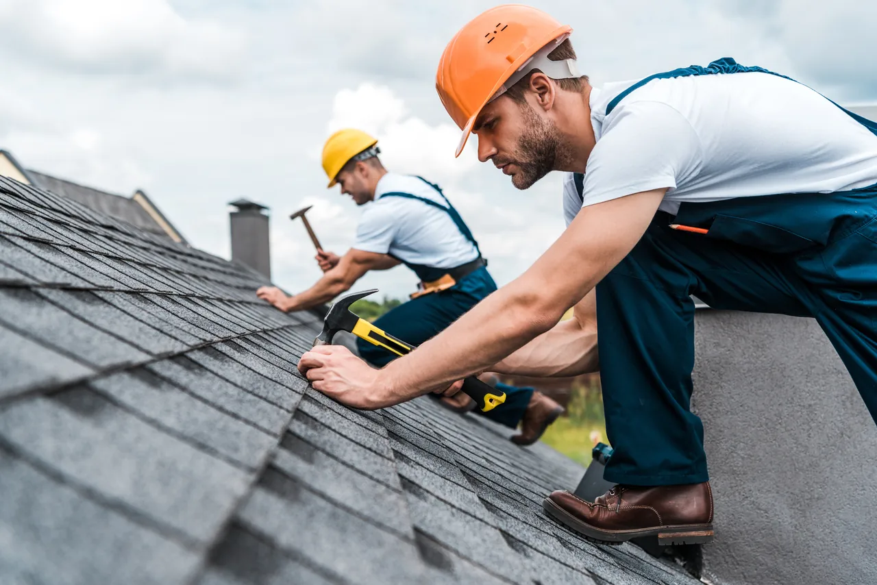 Roofing contractor working on a home in Concord, NC