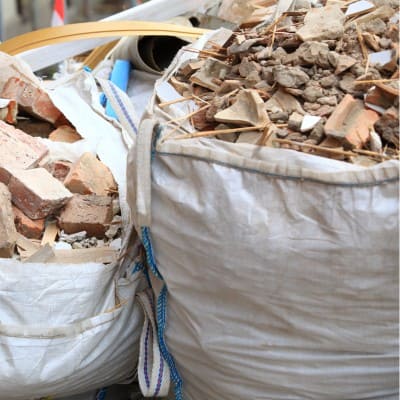 Construction waste in large bags for removal