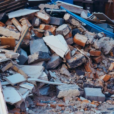 Debris from demolished building with broken materials