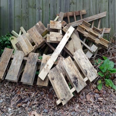 Pile of wooden pallets for disposal in junk removal