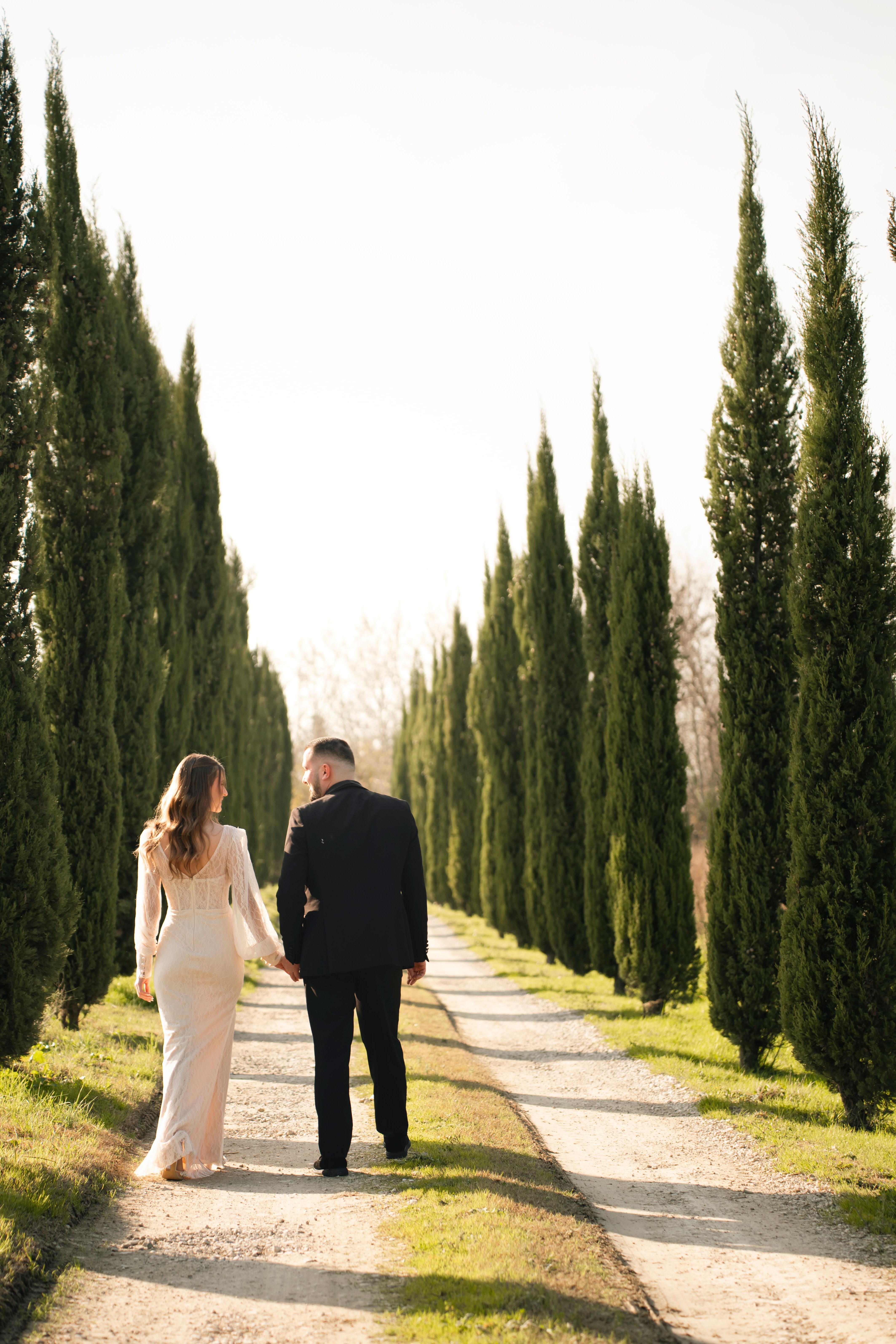 Warm outdoor Italian wedding venue with trees and stone