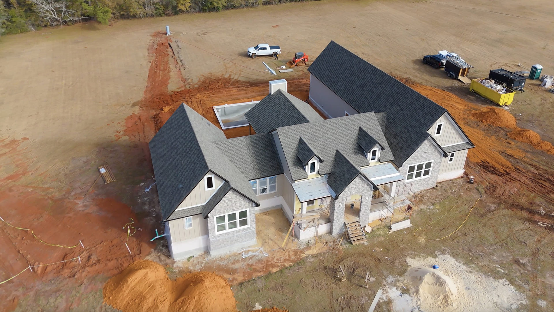 Professional roofer installing new shingles on residential roof